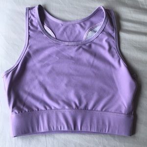 Small purple NVGTN sports bra